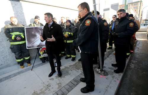 TREVOR HAGAN / WINNIPEG FREE PRESS
Mayor Brian Bowman, Hydro CEO Kelvin Shepherd, and members of the Winnipeg Fire Department paid tribute to fireman who died 90 years ago today during a fire at Adelaide and Notre Dame, Friday, December 23, 2016.