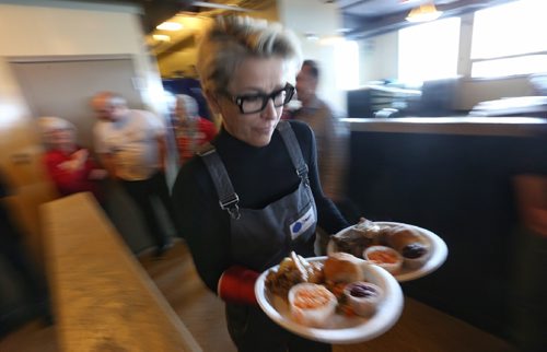 TREVOR HAGAN / WINNIPEG FREE
Not even a broken hand could slow down volunteer Taylor while serving a meal at Siloam Mission on Christmas Eve, Saturday December 24, 2016.