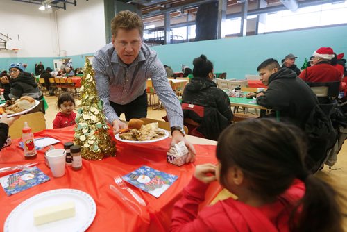 JOHN WOODS / WINNIPEG FREE PRESS
Karl Loepp  serves lunch at the 7TH Annual Loewen family Christmas Dinner in Win Gardner Place Sunday, December 25, 2016.

