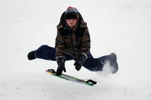 JOHN WOODS / WINNIPEG FREE PRESS
Paul Taphorn catches some air as he slides down Garbage Hill Sunday, December 25, 2016.

