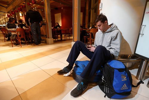 JOHN WOODS / WINNIPEG FREE PRESS
Elliott Viles, a foreign student from Australia, is stuck at the airport after his shuttle to Brandon was cancelled due to weather Sunday, December 25, 2016.

