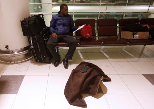 JOHN WOODS / WINNIPEG FREE PRESS
Trevor Williamson, who was attending a wedding in Jamaica, plans to spend his second night at the airport after his flight to Kelowna was cancelled due to weather Sunday, December 25, 2016.

