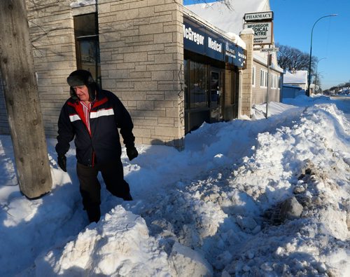 WAYNE GLOWACKI / WINNIPEG FREE PRESS 

Dr. Peter Arnott in front of the McGregor Medical Centre on McGregor St. Tuesday morning. When he arrived he found the sidewalk in front of the office  had a lot of snow on it, unsafe for patients to use. Ashley Prest story    Dec.27 2016