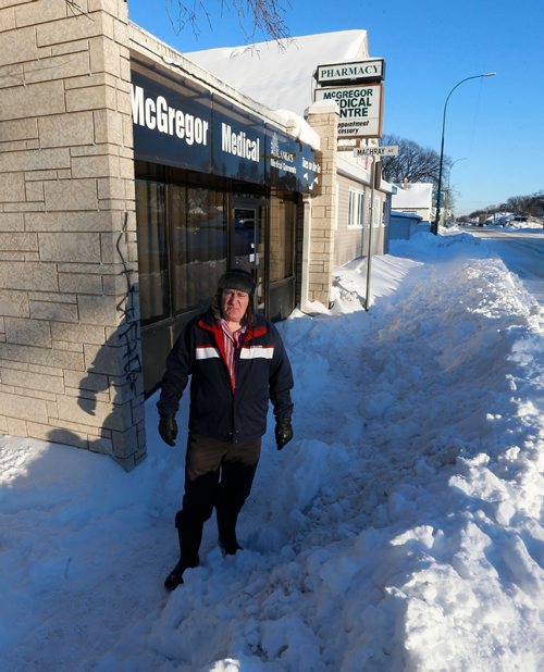 WAYNE GLOWACKI / WINNIPEG FREE PRESS 

Dr. Peter Arnott in front of the McGregor Medical Centre on McGregor St. Tuesday morning. When he arrived he found the sidewalk in front of the office had a lot of snow on it, unsafe for patients to use. Ashley Prest story    Dec.27 2016