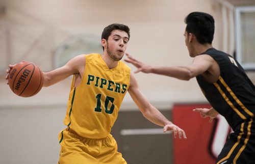 DAVID LIPNOWSKI / WINNIPEG FREE PRESS 

John Taylor Collegiate pipers Ricky Zimbakov (#10) during game against the Fort Richmond Centurions as part of the annual Wesmen Classic Tuesday December 25, 2016 at the Duckworth Centre.