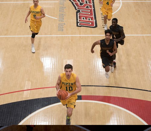 DAVID LIPNOWSKI / WINNIPEG FREE PRESS 

John Taylor Collegiate pipers Ricky Zimbakov (#10) during game against the Fort Richmond Centurions as part of the annual Wesmen Classic Tuesday December 25, 2016 at the Duckworth Centre.