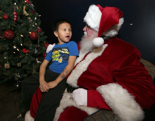 JASON HALSTEAD / WINNIPEG FREE PRESS

Tommy Hastings, 6, visits Santa Claus at the West End Cultural Centres annual holiday dinner and concert on Dec. 22, 2016. (See Social Page)