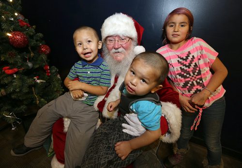 JASON HALSTEAD / WINNIPEG FREE PRESS

L-R: Darnell Cook, 3, his brother Marshall Cook, 2, and their cousin Rosalie Mitchell, 10, visit Santa Claus at the West End Cultural Centres annual holiday dinner and concert on Dec. 22, 2016. (See Social Page)