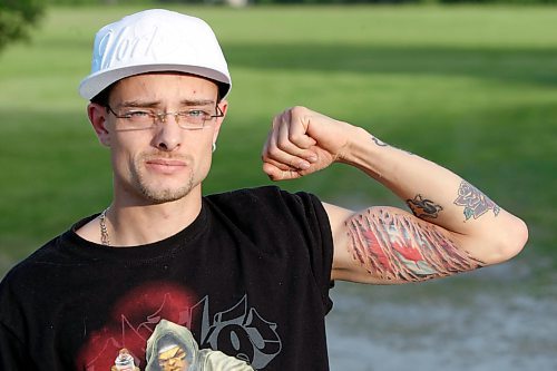 BORIS MINKEVICH / WINNIPEG FREE PRESS  080626 xxxxxx displays his Canadian flag tattoo on his arm. For Megan's Canada day story.