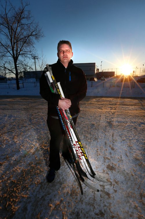 WAYNE GLOWACKI / WINNIPEG FREE PRESS 

Brent  Nemeth holds hockey sticks that were left behind after about 20 hockey sticks, most of which were broken were stolen from his garage on Bonner Ave. He is standing at the end of his driveway, in back is the Gateway Recreation Centre.  The family had collected the hockey sticks from friends and teammates of their son, Cooper Nemeth, who was a victim of a homicide earlier this year.¤ The sticks were going to be made into a "hockey stick bench" memorial for Cooper.¤ Courtney Bannatyne story  Dec.29 2016