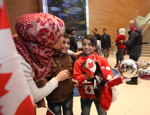 
RUTH BONNEVILLE / WINNIPEG FREE PRESS


Winnipegger Zainab Ali hugs her twin niece and nephew eight-year-old  Mohammad and Zainab Al Ali  after they arrive with their parents, Khaled, his wife Muntaha and their little sister Naya (20mnths) at James Richardson International Airport Thursday afternoon. 
See Carol Sanders story.  
 Dec 29, 2016