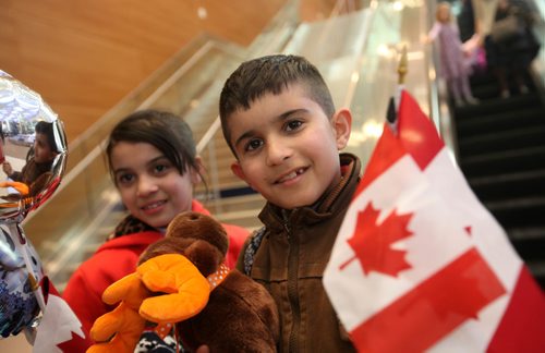 
RUTH BONNEVILLE / WINNIPEG FREE PRESS


Twins  eight-year-old  Mohammad and Zainab Al Ali are all smiles  at James Richardson International Airport after arriving with their parents Khaled, his wife Muntaha and their little sister Naya (20mnths) tThursday afternoon. 
See Carol Sanders story.  
 Dec 29, 2016