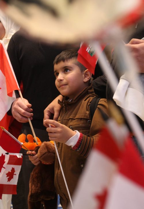 
RUTH BONNEVILLE / WINNIPEG FREE PRESS


Eight-year-old  Mohammad Al Ali is surrounded by Canadian flags and crowds after he arrived with his family: dad - Khaled, mom - Muntaha, twin sister - Zainab and little sister - Naya (20mnths) at James Richardson International Airport Thursday afternoon. 
See Carol Sanders story.  
Dec 29, 2016