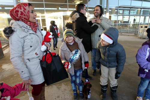 
RUTH BONNEVILLE / WINNIPEG FREE PRESS


The Al Ali Syrian family along with their relatives and friends make their way out of James Richardson International Airport into Winnipeg's winter weather Thursday afternoon
See Carol Sanders story.  
 Dec 29, 2016