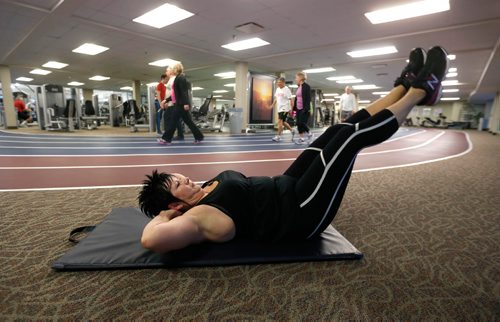 WAYNE GLOWACKI / WINNIPEG FREE PRESS 

Ent. Stacy Thiessen exercises on a mat at the Reh-Fit Centre. Her husband died about two and a half years ago. She spent more than a year laying around on the couch, gaining weight. Basically she had given up. But last January--after a difficult holiday season--she started exercising. Since she has shed about 40 kilograms and just as important, she is in a much better head-space. (A personal trainer and dietitian also provide advice.) Joel Schlesinger story  Dec.30 2016