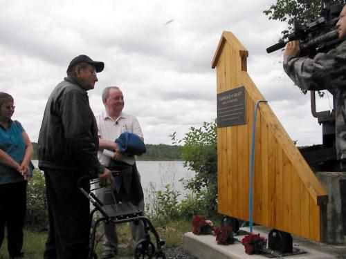 Alex Twohearts, with Hugh Wynn - executive chairman of San Gold Corporation, examines plaque erected Saturday honouring his grandfather Duncan Twohearts, who discovered gold in the Bissett area almost a century ago.  Bill Redekop photo winnipeg free press