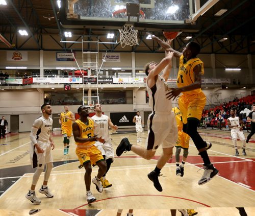 TREVOR HAGAN / WINNIPEG FREE PRESS
Manitoba Bisons' James Wagner drives to the hoop in front of Alberta Golden Bears Mamadou Gueye in the final of the Wesmen Classic, Friday, December 30, 2016.