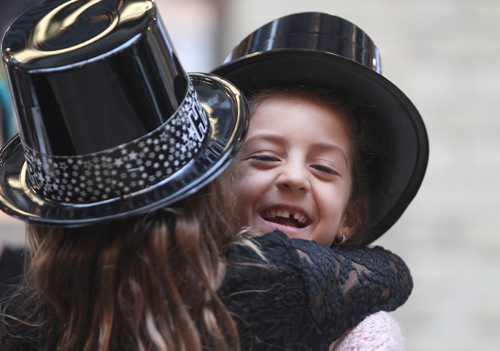 RUTH BONNEVILLE / WINNIPEG FREE PRESS

Chloe Powell (6yrs) and her good friend Geneve Vincent (6yrs back to camera) share some laughs at the Forks while wearing Happy New Years Hats they got from attending a celebration at the Children's Museum earlier on New Years Eve day Saturday.

Standup photo 
 Dec 31, 2016