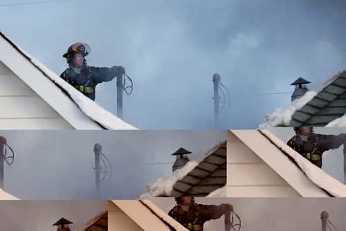 JOHN WOODS / WINNIPEG FREE PRESS
Winnipeg firefighters work a fire at 429 and 425 Bowman Avenue Sunday, January 1, 2017.