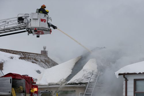 JOHN WOODS / WINNIPEG FREE PRESS
Winnipeg firefighters work a fire at 429 and 425 Bowman Avenue Sunday, January 1, 2017.