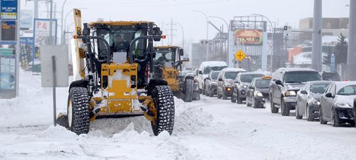 PHIL HOSSACK / WINNIPEG FREE PRESS -  Heavy equipment works northbound lanes on McPhillips Tuesday morning after the city's latest blizzard cleared. At one point over 100 pieces of equipment were clearing streets for the morning rush hour....January 3 ,2017