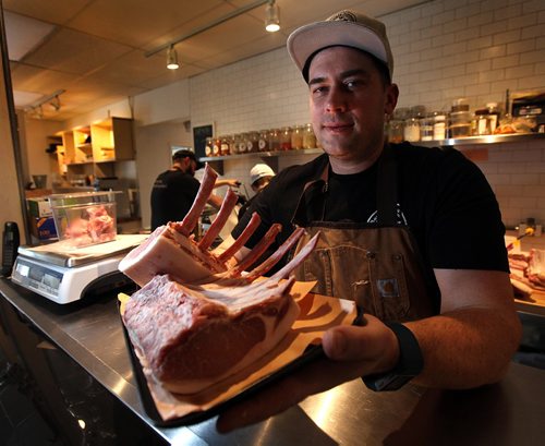 PHIL HOSSACK / WINNIPEG FREE PRESS -  St Boniface butcher Dallas Black poses with a rack of pork ribs after demonstrating the art of taking apart (Butchering) a pig. See Jill Wilson story.  January 3, 2017