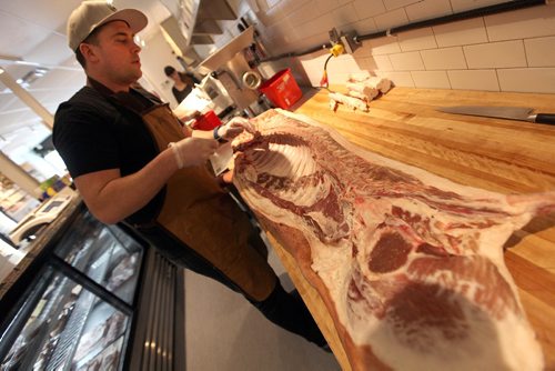 PHIL HOSSACK / WINNIPEG FREE PRESS -  St Boniface butcher Dallas Black demonstrating the art of taking apart (Butchering) a pig. See Jill Wilson story.  January 3, 2017