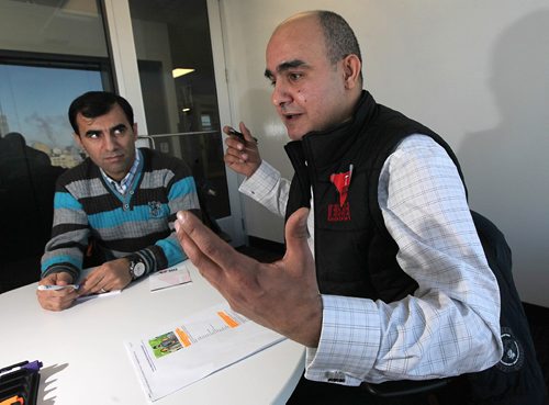 PHIL HOSSACK / WINNIPEG FREE PRESS -  Gesturing his enthusiasm, Nour Ali (right) and Ismail Ibrahim are training to be trainers in workplace safety to teach newcomers to Canada. See Carol Sander's story.   January 4, 2017