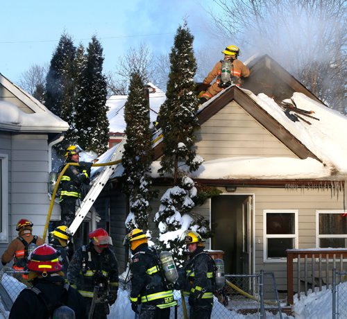 WAYNE GLOWACKI / WINNIPEG FREE PRESS 

Winnipeg Fire Fighters extinguish a fire that caused extensive damage to a house in the 200 block of Bannerman Ave. Wednesday afternoon. Shortly after 1P.M., the fire dept. received the call and when they arrived they found smoke coming from a gable vent. The cause of the fire is under investigation, the damage estimate is $100,000 and no one was injured. Neighbours say the house was vacant. Jan.4 2017