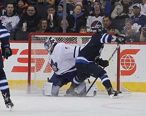 RUTH BONNEVILLE / WINNIPEG FREE PRESS

Manitoba Moose #19 Chase De Leo manages to get the puck around the Toronto Marlies  Goalie #1 Jhonas Enroth tiring up the game 1 all in  1st period action at MTS Centre Wednesday night.  

Jan 04, 2017