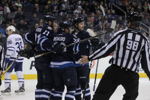 RUTH BONNEVILLE / WINNIPEG FREE PRESS

Manitoba Moose celebrate # 21 QUINTON HOWDEN's power play goal   against Toronto Marlies  Goalie #1 Jhonas Enroth in 2nd  period action at MTS Centre Wednesday night.
Jan 04, 2017