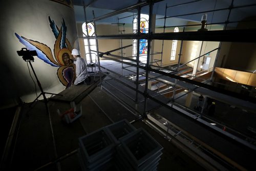 TREVOR HAGAN / WINNIPEG FREE PRESS
Art conservator, Christina Prokopchuk, working on one of several damaged paintings at Holy Trinity Ukrainian Orthodox Metropolitan Cathedral. The church had a fire in July and suffered damages between $3-4 million. They recently announced they'll be holding services in the basement, Thursday, January 5, 2017