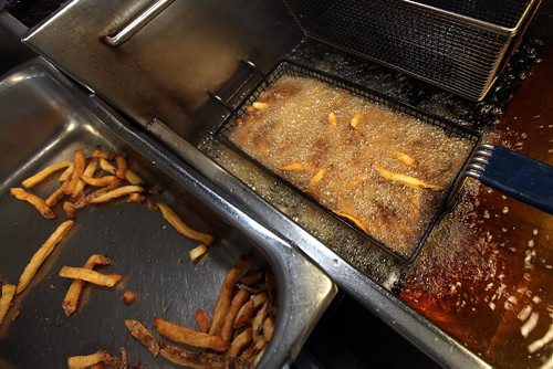 PHIL HOSSACK / WINNIPEG FREE PRESS -  Fries bubble in hot oil before being served fresh to customers at "The Burger Place" on Portage ave. See Dave Sanderson's story. ....January 5 ,2017