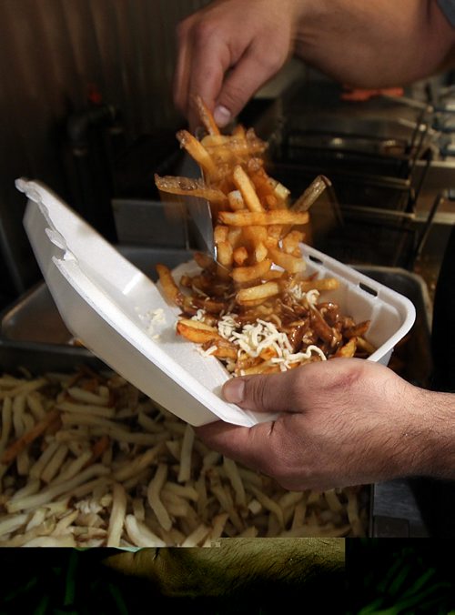 PHIL HOSSACK / WINNIPEG FREE PRESS -  Poutine assembled and served fresh to customers at "The Burger Place" on Portage ave. See Dave Sanderson's story. ....January 5 ,2017