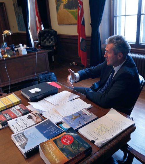 WAYNE GLOWACKI / WINNIPEG FREE PRESS 

Premier Brian Pallister in his office Friday with a sample of the reading material he took to Costa Rica.¤Nick Martin story.  Jan.6  2017
