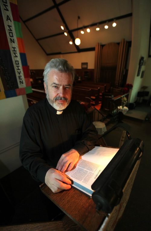 PHIL HOSSACK / WINNIPEG FREE PRESS - .Rev Donald McKenzie poses in his parish at St Philips Church in St Boniface Friday morning. See Intersection piece by Dave Sanderson. ...January 6, 2017