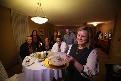 RUTH BONNEVILLE / WINNIPEG FREE PRESS

Daria Lytwyn  holds up a bowl of Kutia, a poppy seed, wheat and honey dish representing prosperity,  the 1st of 12 meatless dishes served on Ukrainian Christmas Eve  at the Duschak - Lytwyn family home on Friday night.  
Standup photo 
 Jan 06, 2017