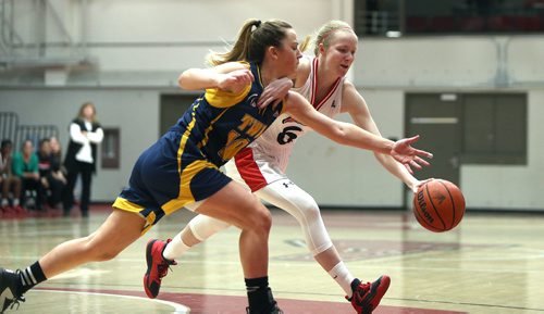 JASON HALSTEAD / WINNIPEG FREE PRESS

University of Winnipeg Wesmen guard Lena Wenke and Trinity Western Spartans guard Jessie Brown reach for a loose ball during Canada West basketball action at the University of Winnipeg on Jan. 6, 2017.