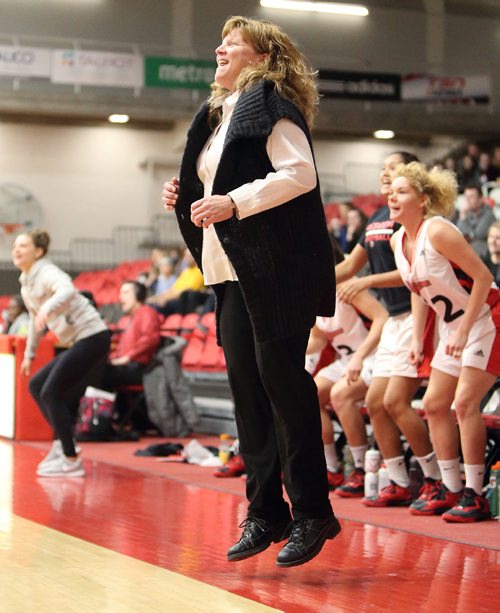 JASON HALSTEAD / WINNIPEG FREE PRESS

University of Winnipeg Wesmen head coach Tanya McKay cheers as her team scores against the Trinity Western Spartans during Canada West basketball action at the University of Winnipeg on Jan. 6, 2017.