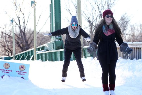 RUTH BONNEVILLE / WINNIPEG FREE PRESS

Kassy Hulls is unsure of her footing as she makes her way over the train bridge with her friend Michelle Peri (red hat) while skating with a group of friends at the Forks Saturday.  
Standup photo 
 Jan 07, 2017