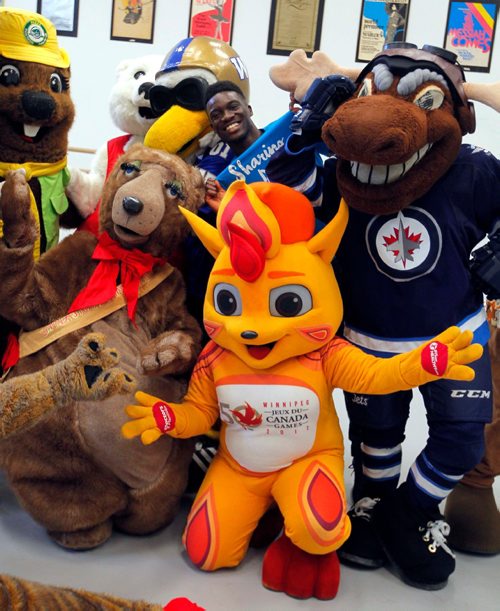BORIS MINKEVICH / WINNIPEG FREE PRESS
Eugene Baffoe, middle back,  one of the Sharing Dance 2017 choreographers and RWB School faculty member poses with the Winnipeg Mascots that showed up to learn the routine. Photo taken in RWB studio downtown. JAN. 10, 2017
Press release below:

LOCAL STDUP - mascot dance-off
The RWB will offer free dance classes open to all ages and skill levels every Tuesday from January 17- June 6. Participants will learn a variety of techniques as well as the choreography for the 2017 Sharing Dance piece. Participants have the option to perform (along with hundreds of people) the routine at the RWB Sharing Dance Day on June 8.


Local mascots such as Niibin from Canada Summer Games, Blue Bombers Buzz and Boomer, and Folklorama Llama will learn part of the Sharing Dance routine. 

Royal Winnipeg Ballet

380 Graham Avenue, Winnipeg
Media is welcome to photograph and record the mascot dance-off.

- RWB School faculty staff member and Sharing Dance 2017 choreographer: Eugene Baffoe
Royal Winnipeg Ballet, 380 Graham Ave