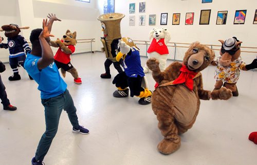 BORIS MINKEVICH / WINNIPEG FREE PRESS
Eugene Baffoe, left in blue t-shirt, one of the Sharing Dance 2017 choreographers and RWB School faculty member teaches the Winnipeg Mascots that showed up to learn the routine. Photo taken in RWB studio downtown. JAN. 10, 2017
Press release below:

LOCAL STDUP - mascot dance-off
The RWB will offer free dance classes open to all ages and skill levels every Tuesday from January 17- June 6. Participants will learn a variety of techniques as well as the choreography for the 2017 Sharing Dance piece. Participants have the option to perform (along with hundreds of people) the routine at the RWB Sharing Dance Day on June 8.


Local mascots such as Niibin from Canada Summer Games, Blue Bombers Buzz and Boomer, and Folklorama Llama will learn part of the Sharing Dance routine. 

Royal Winnipeg Ballet

380 Graham Avenue, Winnipeg
Media is welcome to photograph and record the mascot dance-off.

- RWB School faculty staff member and Sharing Dance 2017 choreographer: Eugene Baffoe
Royal Winnipeg Ballet, 380 Graham Ave