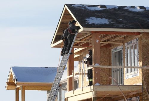 RUTH BONNEVILLE / WINNIPEG FREE PRESS

Biz: Crews work on framing a new home in Bridgwater Trails Tuesday.  See story on high volume of new home sales.  

 Jan 10, 2017