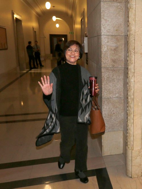WAYNE GLOWACKI / WINNIPEG FREE PRESS 

 Flor Marcelino walks to the meeting with New Democrat MLAs and the party's provincial Tuesday morning to decide the fate of The Maples MLA Mohinder Saran.    Nick Martin/ Kristin Annable stories  Jan.10  2017