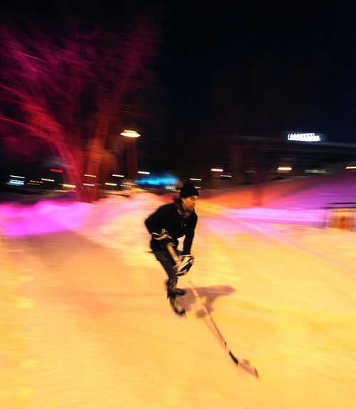 PHIL HOSSACK / WINNIPEG FREE PRESS -  RIVER TRAIL at NIGHT.....A night time skater works on his stick handling as he rounds the trails towards the Scotia Bank stage Tuesday night. Frigid temps were no barrier. Skaters cyclists and walkers started making their appearance Monday night when the Forks River trail opened officially for the season. ....January 10, 2017