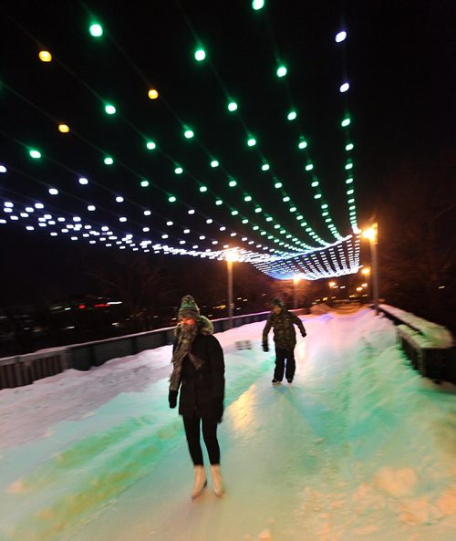 PHIL HOSSACK / WINNIPEG FREE PRESS -  RIVER TRAIL at NIGHT.....A couple dressed for cold make their way across an old rail bridge spanning the Assinaboine River Tuesday night, Skaters cyclists and walkers started making their appearance Monday night when the Forks River trail opened officially for the season. ....January 10, 2017