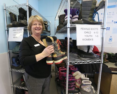 JASON HALSTEAD / WINNIPEG FREE PRESS

Program manager Donna Albak sorts donated boots at Koats for Kids headquarters on Portage Avenue in Assiniboia on Jan. 10, 2017. (See Social Page)