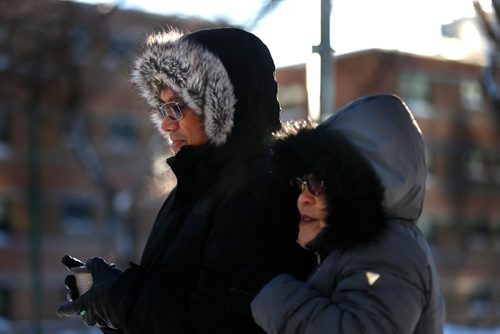 WAYNE GLOWACKI / WINNIPEG FREE PRESS 

Many and Beth are dressed for the -22C weather on Broadway Wednesday afternoon.  weather story.  Jan.11  2017