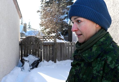 WAYNE GLOWACKI / WINNIPEG FREE PRESS 

Izabella Roberts by her home where her daughter overturned the garbage bin to climb into the backyard Tuesday . Tumia wasn't picked up by the school bus Tuesday and was outside for 2.5 hours when her mother found her in their back yard. Alex Paul  story Jan.11  2017