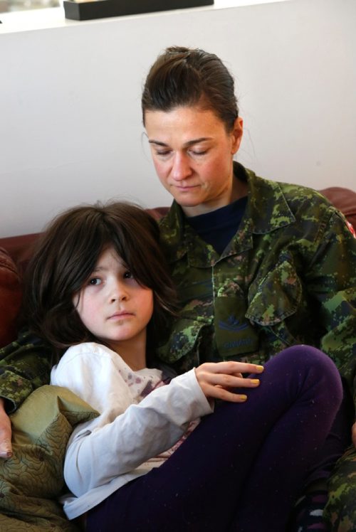 WAYNE GLOWACKI / WINNIPEG FREE PRESS 

Tumia Roberts, 9, and her mother Izabella Roberts at home Wednesday. Tumia wasn't picked up by the school bus Tuesday and was outside for 2.5 hours when her mother found her in their back yard. Alex Paul  story Jan.11  2017